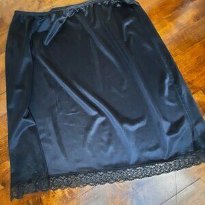 Black satin slip or skirt with lace trim on hem, whimsigothic